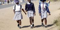 epaselect epa10016351 Children walk from school in Epworth just outside the capital Harare, Zimbabwe, 16 June 2022 on the Day of The African Child, which is marked annually on 16 June to recognize those who lost their lives in South Africa's Soweto Uprising on 16 June 1971, and the ongoing need to improve children education in Africa.  EPA-EFE/AARON UFUMELI