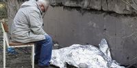 A relative sits next to the covered body of a 9-year-old girl near a health center damaged in a missile strike in Kyiv (Kiev), Ukraine, 01 June 2023, amid the Russian invasion. At least three people died, including a child, and ten others were injured after a missile attack on the Ukrainian capital, the National Police said. Russian troops entered Ukrainian territory in February 2022, starting a conflict that has provoked destruction and a humanitarian crisis.  EPA-EFE/SERGEY DOLZHENKO