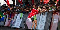 Tete Dijana celebrates winning the 2025 Comrades Marathon finishing outside People's Park on 8 June 2025 in Durban, South Africa. (Photo: Darren Stewart / Gallo Images)