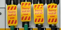 Fuel pumps are marked "Sorry out of use" as a Shell petrol station waits for a delivery on September 27, 2021 in  Northwich, United Kingdom. The British government will temporarily exempt the oil industry from the Competition Act 1998, which will allow companies to share information and target fuel deliveries in parts of the country where retail supply is lowest. Over the weekend, the Petrol Retailers Association (PRA), which represents around 5,500 independent retailers, said roughly two-thirds of its members had reported running out. (Photo by Christopher Furlong/Getty Images)