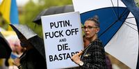 epa09782985 Protesters hold signs during a rally against the war in Ukraine at Martin Place in Sydney, Australia, 25 February 2022.  EPA-EFE/BIANCA DE MARCHI  AUSTRALIA AND NEW ZEALAND OUT