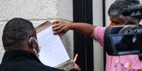 Rev Frank Chikane and Neeshan Balton, executive director of the Ahmed Kathrada Foundation, were among those who signed the memo and slid it under the gate of the UAE Embassy in Pretoria. (Photo: Julia Evans)