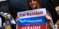 epa09783002 Protesters hold signs during a rally against the war in Ukraine at Martin Place in Sydney, Australia, 25 February 2022.  EPA-EFE/BIANCA DE MARCHI  AUSTRALIA AND NEW ZEALAND OUT