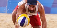 TOKYO, JAPAN - JULY 30: Grzegorz Fijalek #2 of Team Poland competes against Team Brazil during the Men's Preliminary - Pool E beach volleyball on day seven of the Tokyo 2020 Olympic Games at Shiokaze Park on July 30, 2021 in Tokyo, Japan. (Photo by Sean M. Haffey/Getty Images)