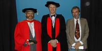 In 2002, Randy Bush (left) was awarded an Honorary Doctorate from Rhodes University. To his right are Pat Terry and Jacot. Image: Supplied / François Jacot-Guillarmod