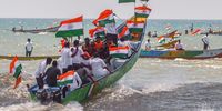 Supporters of the Bharatiya Janata Party (BJP) and Indian fishermen with their fishing boats tied up with the national flags take part in a boat rally to celebrate the 75th Independence Day of India, at Neelangarai beach in Chennai on 10 August 2022. (Photo: EPA-EFE / Idrees Mohammed)