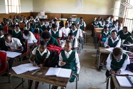 What happened when a South African school switched from English to bilingual science tests