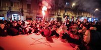epa10352794 Fans of Morocco celebrate in the Barriera di Milano neighborhood of Turin, Italy, 06 December 2022, after the FIFA World Cup 2022 round of 16 soccer match between Morocco and Spain in Qatar. Morocco beat Spain on penalties and advanced to the quarter finals.  EPA-EFE/Tino Romano