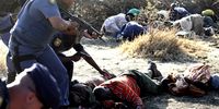 In this file pic, members of the South African Police approach injured Lonmin mine workers after they opened fire on the striking miners, killing 37 of them. This year marks the eighth anniversary of the Marikana massacre. (Photo: EPA/Kevin Sutherland)