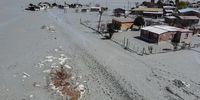 Houses surrounded by mud when the tailings dam burst open from the nearby  local mine in Jagersfontein on 12 September 2022. Photo: Felix Dlangamandla)