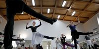 epa09826974 A Romanian choreography instructor woman (L - foreground) directs the ballet dancers of the Bucharest National Opera and their refugee guests for a rehearsal session in Bucharest, Romania, 15 March 2022. The Bucharest National Opera joined the efforts to help artists who were victims of the war Russian-Ukrainian conflict, receiving seven refugee ballet dancers from Ukraine to Romania, who also began their study program. Refugee artists study with the ballet dancers and ballet masters of the Bucharest Opera, thus ensuring their professional continuity. The dancers from Ukraine have already been cast in two of the performances of the Bucharest Opera: 'Giselle', by Adolphe Charles Adam and 'Raymonda', by Alexander Glazunov. The ballet dancers participate at rehearsals for these two works.  EPA-EFE/ROBERT GHEMENT  ATTENTION: This Image is part of a PHOTO SET