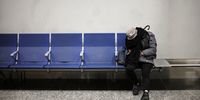 A person rests at Aeroparque Jorge Newbery airport, during a 24-hour general strike against Argentina's President Javier Milei government's adjustment policy, in Buenos Aires, Argentina May 9, 2024. REUTERS/Agustin Marcarian     TPX IMAGES OF THE DAY