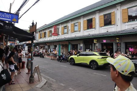 Bangkok, a fever dream in neon and sepia, feeds hungry souls
