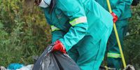The Green Army clears waste at an illegal dump site in Moroka, Soweto during a clean-up operation in the area. Food has been found to be one of the major items dumped in the area. (Photo: Sandile Nkomo / GDARDE)