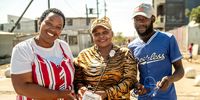 From left: Nobuzwe Pikashe, Lebohang Mponya, and Angeziwe Njameni in Cape Town with the fitted temperature sensor they attached to their vehicles and drove on pre-planned routes across their cities, collecting thousands of heat and humidity measurements. (Photo: Chris Morgan for the World Bank)
