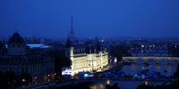 A general view of the Paris Skyline as boats are seen passing in front of  the Conciergerie on the River Seine during the opening ceremony of the Olympic Games Paris 2024 on July 26, 2024 in Paris, France.  (Photo by Dan Mullan/Getty Images)