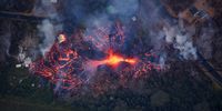 A fissure eruption near the intersection of Hinalo St and Pohoiki Road, consumes a home as eruptive activity continues on Kilauea's east rift zone, Pahoa, Hawaii, USA 18 May 2017. Scientists say that the lava  discharged up to this point, was magma that had been stored in chambers since the 1955 eruption, but now, we're seeing the much more fluid lava from Pu'u O'o's collapse.  EPA-EFE/BRUCE OMORI/PARADISE HELICOPTERS