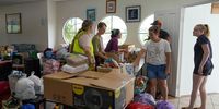  Volunteers process donations brought in by residents to assist flood victims at the Cairns Cruising Yacht Squadron evacuation centre in Cairns, Queensland, Australia, 18 December 2023. Residents in far north Queensland are bracing for more rain and further significant flooding.  EPA-EFE/NUNO AVENDANO AUSTRALIA AND NEW ZEALAND OUT