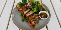 Goo’s crispy pork belly served on crunchy stir fry veggies served with a sun-dried chilli sauce. (Photo: Wanda Hennig)
