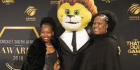 South Africa National Women's Cricket bowler, Tumi Sekhukhune on the red carpet with her mother and Cricket South Africa mascot Zac. Sekhukhune received the International Women’s Newcomer of the Year award. (Photo: Yanga Sibembe)
