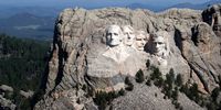 The busts of US presidents George Washington, Thomas Jefferson, Theodore Roosevelt and Abraham Lincoln tower over the Black Hills at Mount Rushmore National Monument on 2 July 2020 near Keystone, South Dakota. (Photo: Scott Olson / Getty Images)
