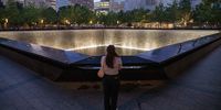 A person looks at the south reflecting pool before the annual 9/11 Commemoration Ceremony at the National 9/11 Memorial and Museum on September 11, 2025 in New York City. Government officials joined family, friends, and first responders as they gathered at Ground Zero honoring the lives of their loved ones on the 24th anniversary of the terror attacks of September 11, 2001, at the World Trade Center. (Photo by Adam Gray/Getty Images)