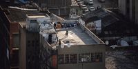 Residents on the roof of a tower block in Johannesburg, South Africa, on Tuesday, Aug. 15, 2023. The summit of BRICS leaders is scheduled to take place from Aug. 22-24 in Johannesburg, where they'll discuss whether to admit more nations to its ranks. Photographer: Michele Spatari/Bloomberg via Getty Images