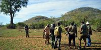 Members of the African Safari Brotherhood on a bushwalk near Berg en Dal<br>in the Kruger National Park. The group is made up of people from<br>different parts of SA who are on a mission to encourage more black<br>people to take part in wildlife and camping activities from which they<br>were excluded through various laws under Apartheid. Photo: Lucas<br>Ledwaba/Mukurukuru Media