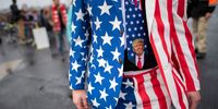 LITITZ, PA - OCTOBER 26: A man wearing a patriotic suit and Donald Trump themed tie joins supporters queueing before President Donald Trump holds a rally on October 26, 2020 in Lititz, Pennsylvania.  With 8 days to go before the election, Trump is holding 3 rallies across Pennsylvania, a crucial battleground state.  In 2016, Trump won Pennsylvania by only 44,000 votes out of more than 6 million cast, the first Republican to carry the Keystone State since 1988. (Photo by Mark Makela/Getty Images)