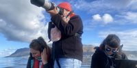 Sasha Dines (left) records dolphin acoustics with SeaSearch colleagues in False Bay. (Photo: SeaSearch)