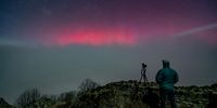 epaselect epa12520601 A photographer captures the northern lights (aurora borealis) shining over Salgotarjan, northern Hungary, 12 November 2025.  EPA/PETER KOMKA