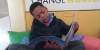 A learner from Grahamstown Primary enjoys a book from the Lebone Centre’s own Classroom Library (Photo: Kajal Premnath)