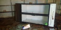 A fridge lies on its side after it broke while looters tried to lift it. PHOTO: BHEKI SIMELANE
