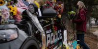 BOULDER, CO - MARCH 23: Mourners pay their respects to Officer Eric Talley, who was killed after a gunman opened fire at a King Sooper's grocery store on March 23, 2021 in Boulder, Colorado. Ten people were killed in the attack. (Photo by Chet Strange/Getty Images)