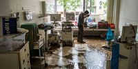 BAD NEUENAHR, GERMANY - JULY 17: Employees, aides and doctors shovel mud, furniture and files from a clinic on July 17, 2021 in Bad Neuenahr, Germany. While the water masses are slowly receding from many flooded areas in North Rhine-Westphalia and Rhineland-Palatinate, the search for fatalities continues in the rubble of the disaster areas. By Saturday, that number had risen to more than 130, with more than 90 people killed in the greater Ahrweiler area alone, according to police. (Photo by Thomas Lohnes/Getty Images)