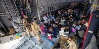 TASHKENT, UZBEKISTAN - AUGUST 17: In this handout image provided by the Bundeswehr,  evacuees from Kabul sit inside a military aircraft as they arrive at Tashkent Airport on August 17, 2021 in Tashkent, Uzbekistan. One of three German military planes evacuated some 131 people from Kabul airport to the Uzbek capital of Tashkent before reaching their final destination in Germany.  (Photo by Marc Tessensohn/Bundeswehr via Getty Images)