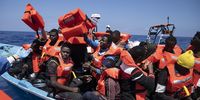 Migrants from West Africa are given life jackets and brought aboard the Geo Barents, a rescue vessel operated by Doctors Without Borders on June 10, 2021. As the world felt like it was emerging from Covid in early 2021, there was a new surge in migration across the Central Mediterranean. At the same time, European countries locked down their borders, and the EU border agency began to increasingly rely on and collaborate with the Libyan Coast Guard (LCG) to keep the migrants from European shores, giving the LCG assistance in intercepting migrant boats. As a result, this year has seen a dramatic increase in the deadliness of these crossings. Amid these pressures, humanitarian ships have slowly begun resuming their operations. (Ed Ou/The Outlaw Ocean Project)
