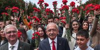 Turkish presidential candidate Kemal Kilicdaroglu (C), leader of the opposition Republican People's Party (CHP), carries flowers as he visits Anitkabir, the mausoleum of the founder and first President of the Republic of Turkey, Mustafa Kemal Ataturk, in Ankara, Turkey, 13 May 2023. Turkey will hold its general election on 14 May 2023 with a two-round system to elect its president, while parliamentary elections will be held simultaneously.  EPA-EFE/SEDAT SUNA