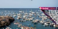 POLIGNANO A MARE, ITALY  - SEPTEMBER 26: (EDITORIAL USE ONLY) In this handout image provided by Red Bull, Constantin Popovici of Romania dives from the 27.5 metre platform during the final competition day of the sixth and final stop of the Red Bull Cliff Diving World Series on September 26 2021 at Polignano a Mare, Italy. (Photo by Romina Amato/Red Bull via Getty Images)