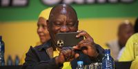 epaselect epa10373786 South African and ANC President, Cyril Ramaphosa takes a photograph of the media after retaining the Presidency of the ANC during  the 55th ANC (African National Congress) National Conference held in Johannesburg, South Africa, 19 December 2022. The event held every five years determines the leader of the ANC and the TOP 6 of the party as well as future ANC policy. This conference will be critical in the future of South African President Cyril Ramaphosa as he tries to retain leadership of the party after the damming Phala Phala report.  EPA-EFE/KIM LUDBROOK