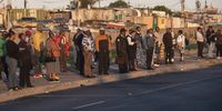 Commuters at Borchards Quarry at Nyanga on November 21, 2022 in Cape Town, South Africa. It is reported that law enforcement have been deployed to respond to the threatened public transport shutdown and strike. (Photo by Gallo Images/Brenton Geach)