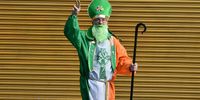 DUBLIN, IRELAND - MARCH 17: A man dressed in a St. Patrick costume poses for a picture on St. Patrick's Day in Dublin city centre on March 17, 2021 in Dublin, Ireland. St. Patrick's Day has again been cancelled this year due to the Covid pandemic. The police are warning would-be lockdown protestors to stay away from potential flashpoints. (Photo by Charles McQuillan/Getty Images)