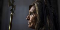 A woman attends the Divine Captive procession as it travels through the streets during Good Friday celebrations, in Madrid, Spain, 07 April 2023.  EPA-EFE/Daniel Gonzalez