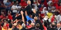 Morocco’s head coach Walid Regragui (up) and his players celebrate after winning the Fifa World Cup 2022 quarterfinal match against Portugal at Al Thumama Stadium in Doha, Qatar, 10 December 2022. (Photo: EPA-EFE / Georgi Licovski)