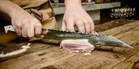 Chef Mathew Armbruster test-runs a sujihiki, ideal for carving meat. (Photo: Sebastian Nico)<br>