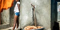 This tap, situated near Yola Mgogwana’s house in Khayelitsha (Cape Town), is shared by 55 families for multiple purposes.<br>(Photo: Newton Stanford)