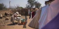 Leah Mothusi as she hangs as she does her washing. As an aged lady she feels that communal taps should be located closer to residents homes. (Photo: Shiraaz Mohamed)