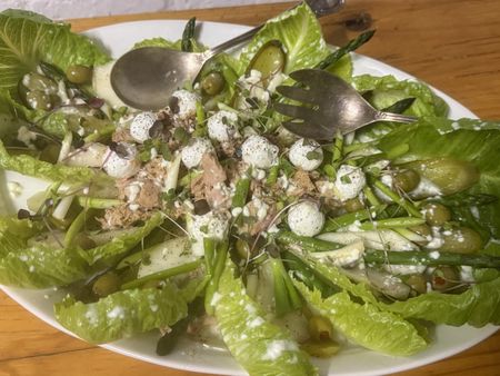 Tuna salad with asparagus, pear, green olives, gherkins and feta balls
