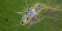 BISKVITNE, UKRAINE - MAY 16: As seen from above, the remains of a Russian helicopter lies in a bomb-cratered field on May 16, 2022 in Biskvitne, Ukraine to the east of Kharkiv. Ukrainian and Western officials say Russia is withdrawing forces around Kharkiv, Ukraine's second-largest city, suggesting it may redirect troops to Ukraine's southeast. (Photo by John Moore/Getty Images)