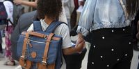 epa09442349 Childrens arrive for the first day of school after the summer holidays at the primary school in Bordeaux, France, 02 September 2021. More than 12.26 million students from kindergarten to high school are back in class, where they will find about 869,300 teachers  against 866,500 teachers in September 2020.  EPA-EFE/CAROLINE BLUMBERG